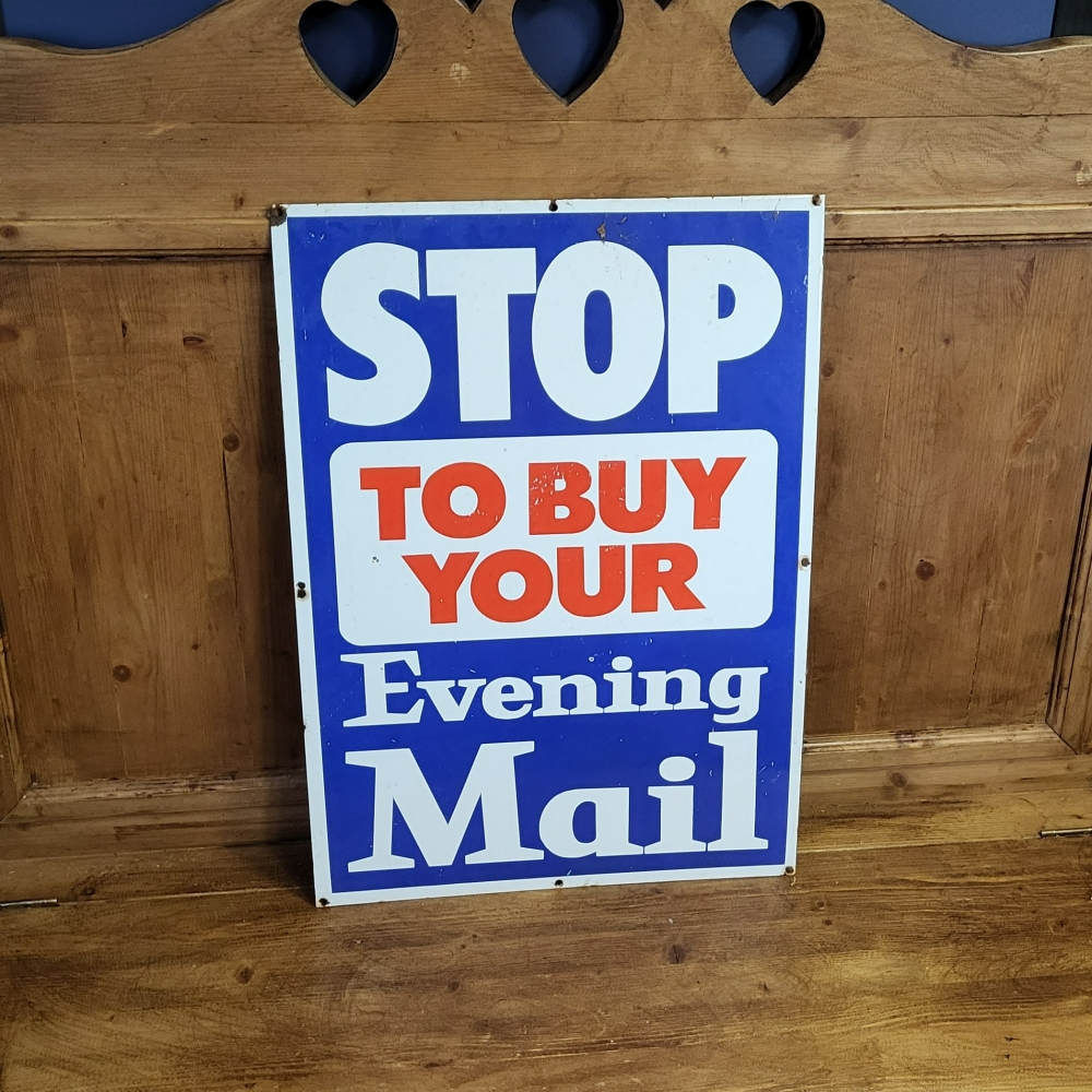 An EVENING MAIL enamel sign 24 x 17 inches